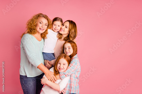 Close up photo sweet foxy little girls mom granny standing close tight leisure toothy smile glad weekend spend free time wear sweaters shirts pullovers isolated on rose background