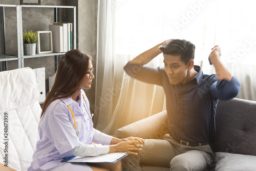 Asian woman doctor,gynecologist,psychiatrist consult and listen problem male patient at relax room in hospital.