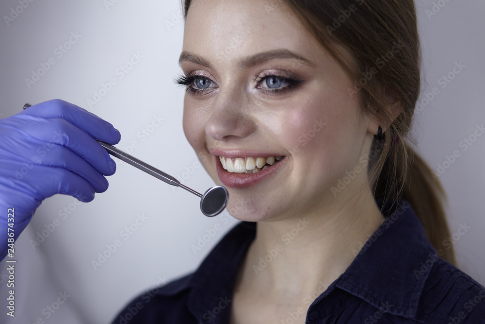 beautiful girl in the dental chair on the examination at the dentist beautiful girl in the dental chair on the examination at the dentist