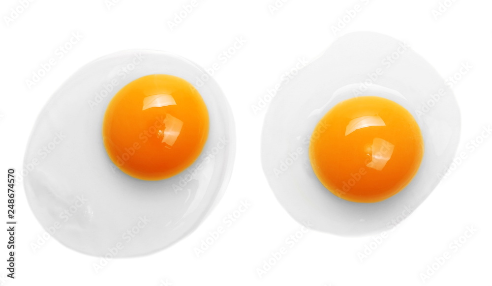 Raw eggs with yolks isolated on white background, top view Raw eggs with yolks isolated on white background, top view