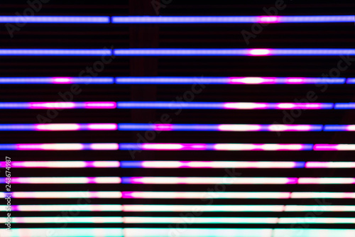 Blured, defocused music beat equalizer on black background, audio equalizer lines.