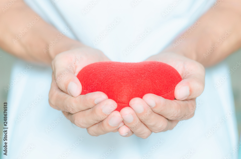 handsome man holding red heart in hands giving for love life healthy care medicine hospital concept and lovely romantic for valentines day.