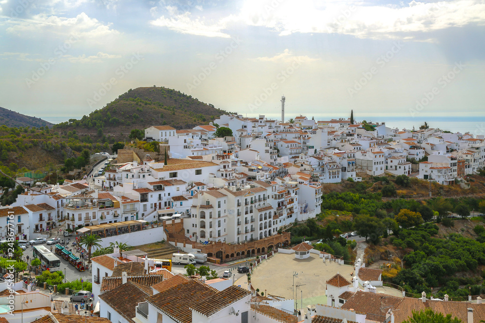 Stunning view of Frigiliana in Málaga and the mediterranean sea with sunlight on the horizon abeautiful landscape