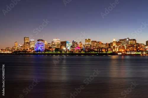 Night view of the Montreal city skyline with St Lawrence river