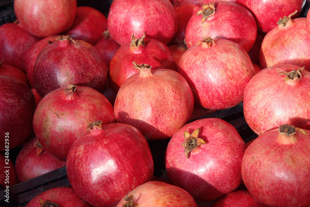 Rows Of Pomegranates. Pomegranate Closeup, Background. Group Of Ripe Pomegranates Rows Of Pomegranates. Pomegranate Closeup, Background. Group Of Ripe Pomegranates