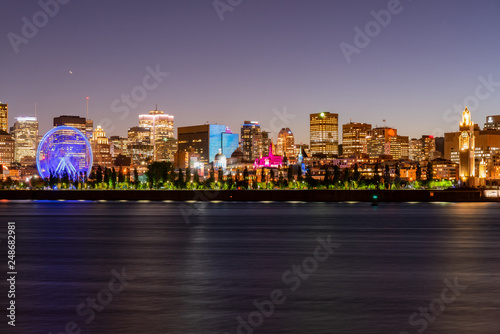 Night view of the Montreal city skyline, city hall with St Lawrence river