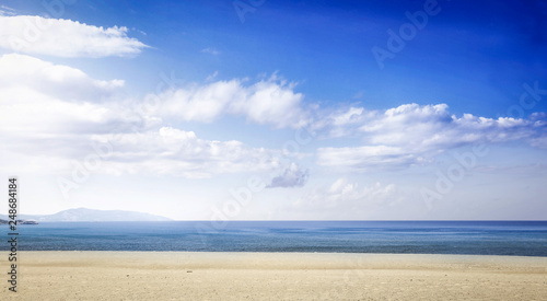 Fototapeta Naklejka Na Ścianę i Meble -  Beach background of yellow sand and sea landscape with blue sky. Free space for your decoration. 