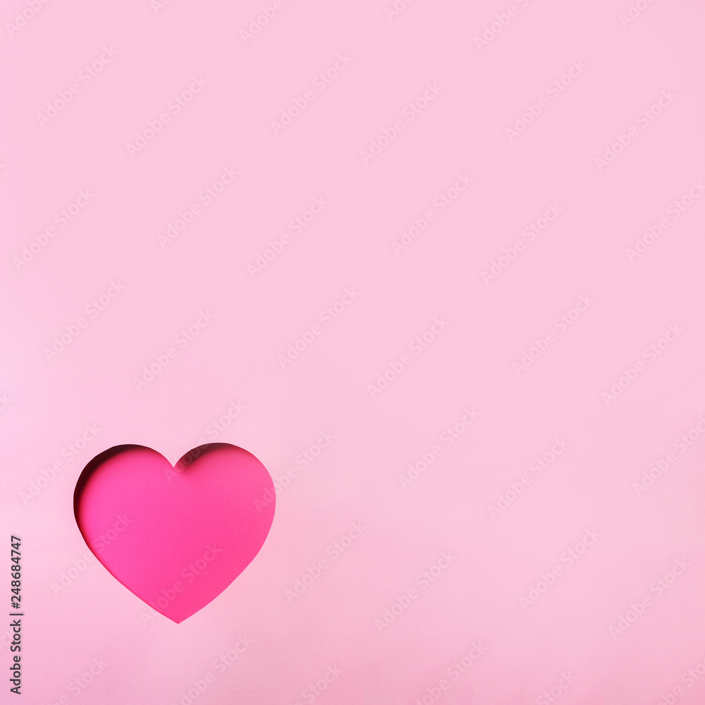 Valentines day card. Cutted heart in punchy pastel paper background. Minimalist concept. Love, date, romantic concept.