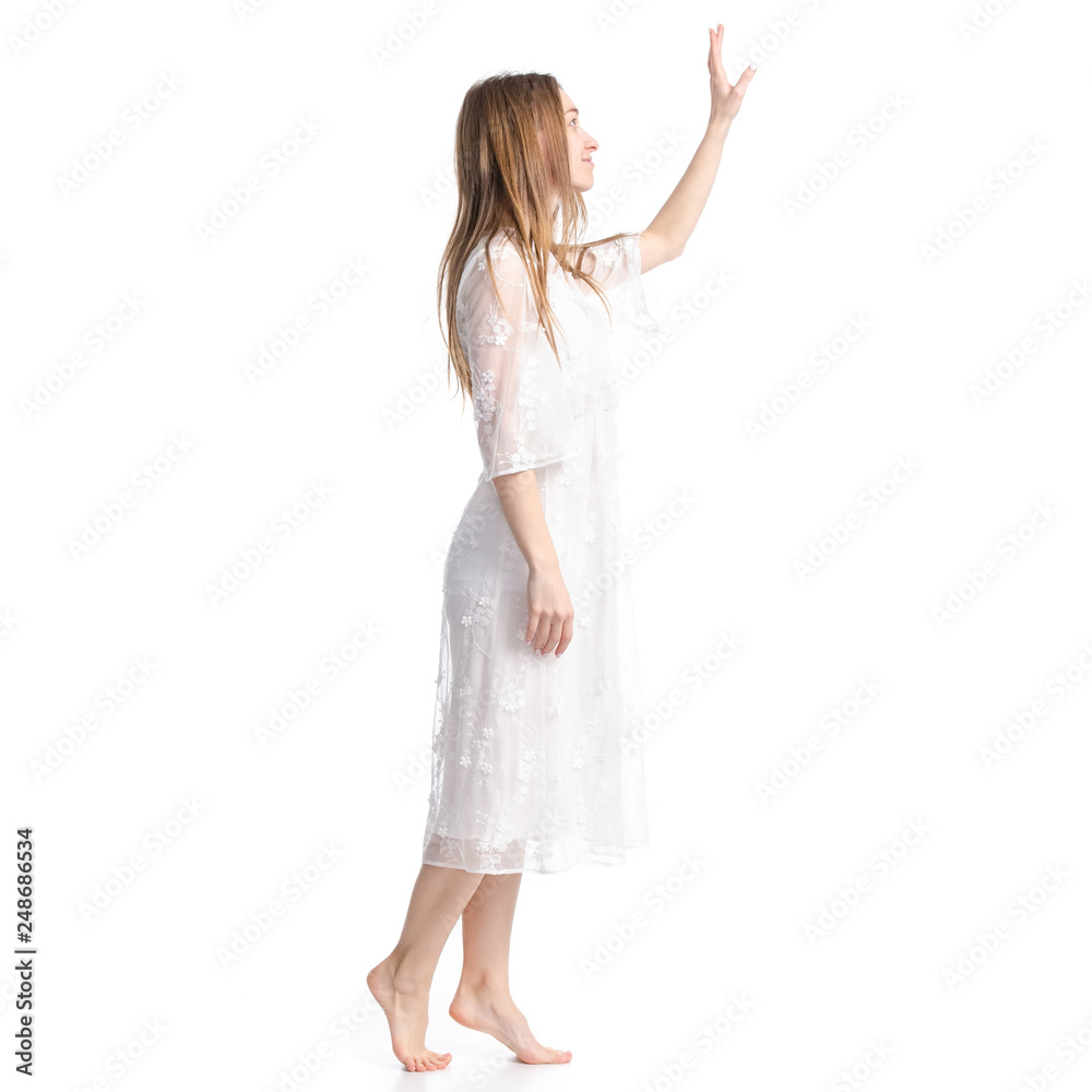 Woman in white dress summer spring laced goes showing pointing on white background isolation