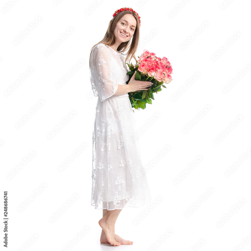 Woman in dress with flowers roses in hand on white background isolation Woman in dress with flowers roses in hand on white background isolation