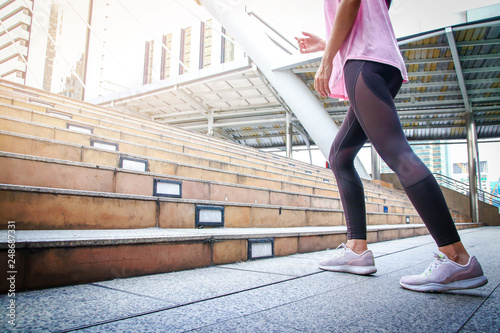 Fitness woman By running up the stairs. © SUPERMAO