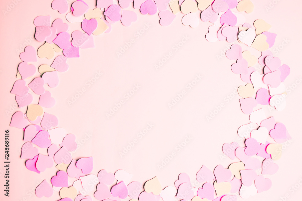 Pink frame made of small hearts for text, copy space. The concept of Valentine Day. Flat lay, top view.