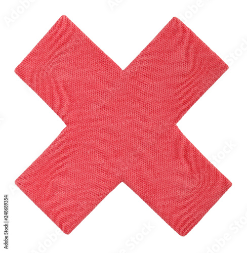 Mark X, red cross of cotton fabric. No icon for your design. Handmade Reject sign isolated on white