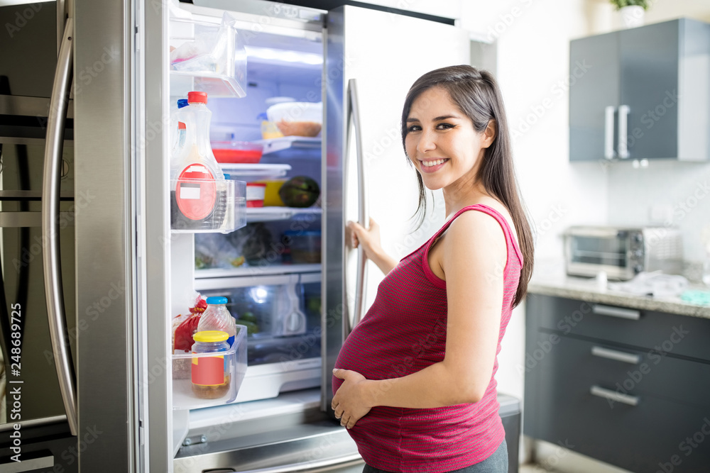 Woman Near Fridge Looking For Food During Pregnancy Woman Near Fridge Looking For Food During Pregnancy