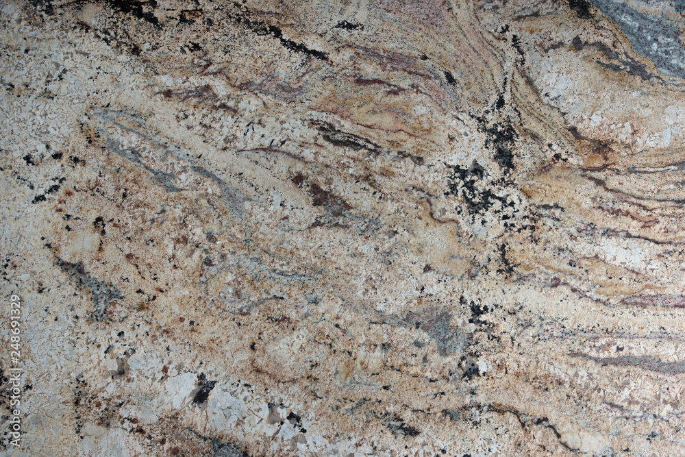 Beige granite with beautiful patterns on the surface, called Golden cascade Beige granite with beautiful patterns on the surface, called Golden cascade