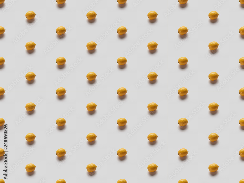 flat lay with yellow bright lemons on grey background, seamless pattern flat lay with yellow bright lemons on grey background, seamless pattern