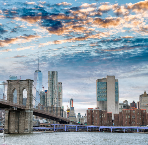 Brooklyn Bridge and Lower Manhattan skyline at dusk