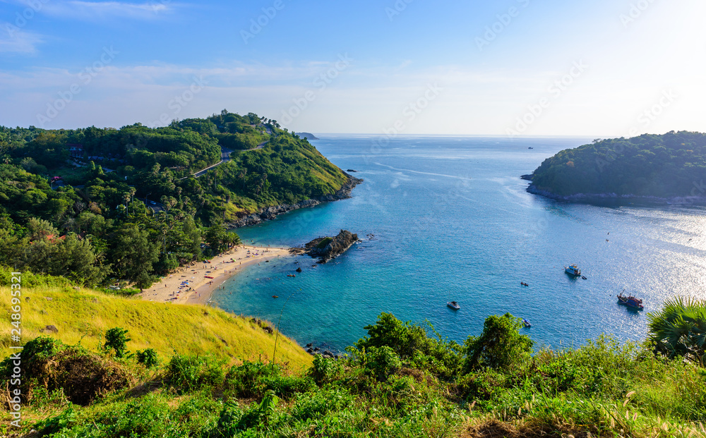 Sunset over Promthep Cape and Yanui beach. Tropical coast with paradise beaches on Phuket, Thailand. Sunset over Promthep Cape and Yanui beach. Tropical coast with paradise beaches on Phuket, Thailand.