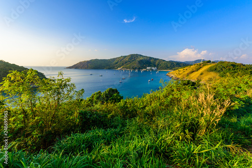 Tropical bay at Naiharn and Ao Sane beach with boats at windmill viewpoint, Paradise destination Phuket, Thailand photo