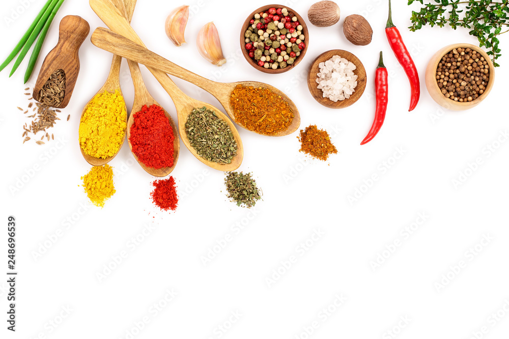 mix of spices in wooden spoon isolated on a white background with copy space for your text. Top view. Flat lay. Set or collection - obrazy, fototapety, plakaty 