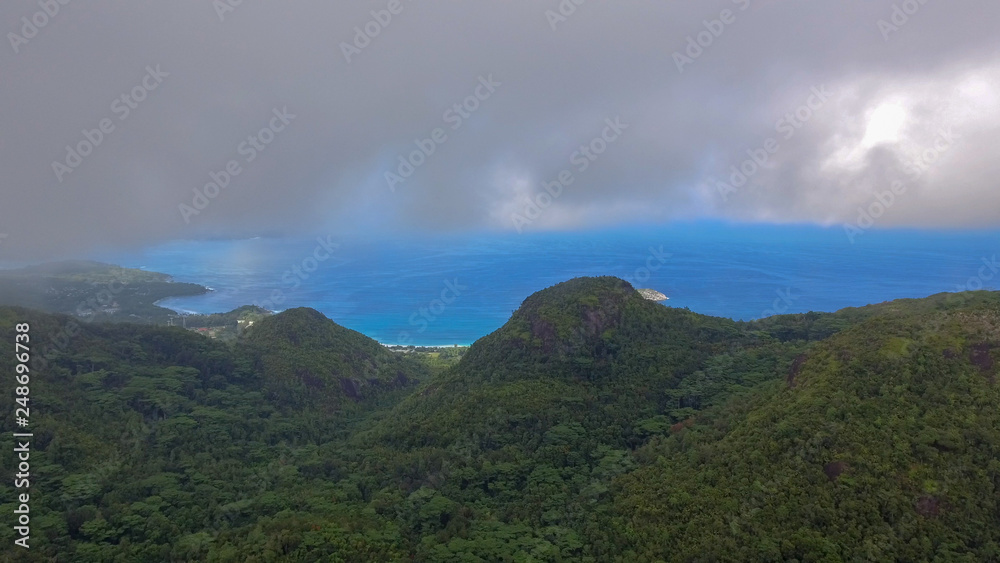 Mountain and ocean of Seychelles on a foggy day