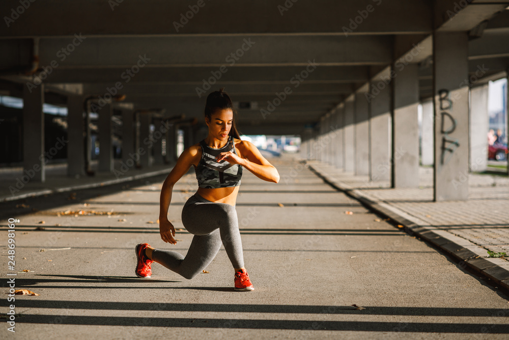 Young sports woman stretching outdoors Young sports woman stretching outdoors