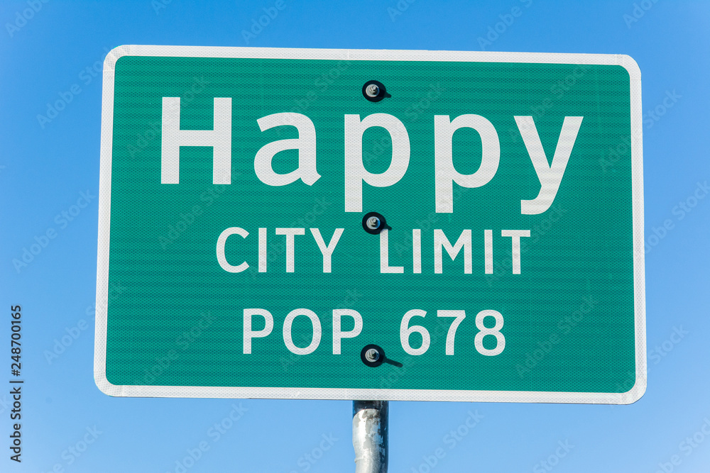 Happy city limit road sign in Texas.