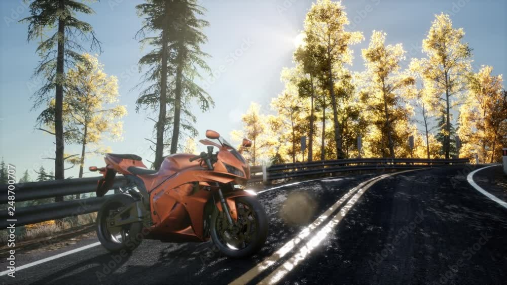 sportbike on tre road in forest with sun beams sportbike on tre road in forest with sun beams