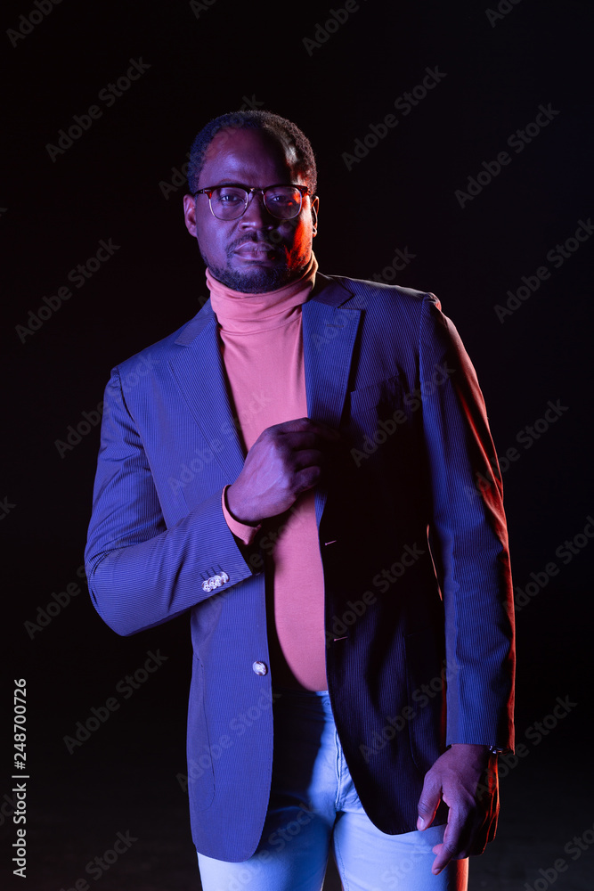 Pleased young businessman posing before his photographer