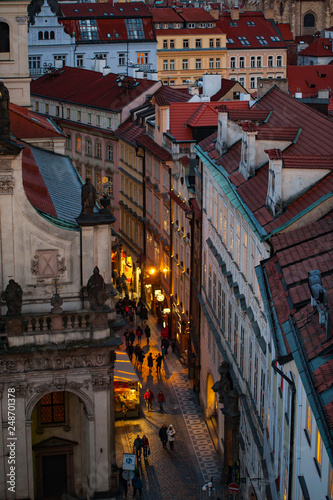 View on the roofs and street in Stare Misto. Prague. Sunset