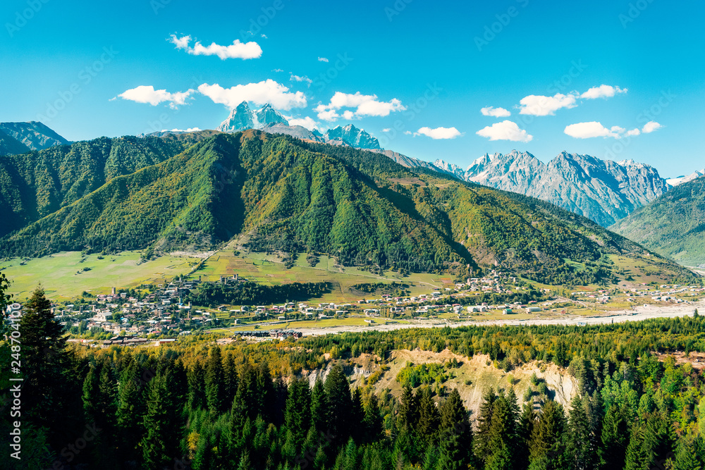 Amazing panorama view above town of Mestia in famous Caucasus region Svaneti, North Georgia with high mountain peaks in the background