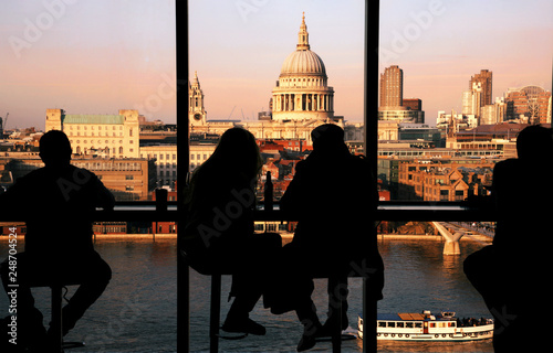Photography A couple tourists overlooking St Paul's Cathedral and Millennium Bridge at Sunset