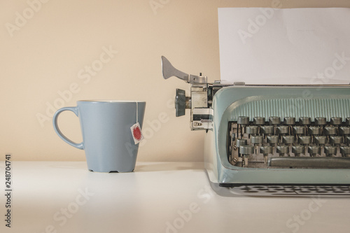 old typewriter and cup