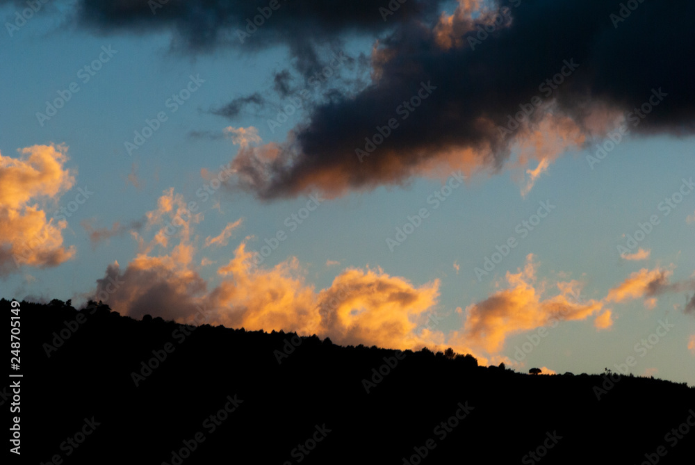Silhouette mountains sunset dramatic in Guatemala. Silhouette of trees, mountains and volcano in central america.