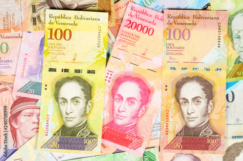 Venezuela bolivar banknotes, different bills of fuerte and soberano series. Venezuelan bolivar fuerte. beautiful colorful obverse side bolivares close up background. photo