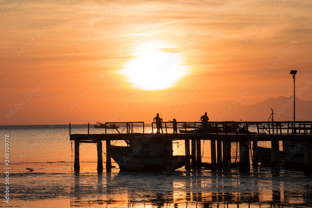 beautiful sunset on the pier of the guaratiba stone (pedra de guaratiba), in the west side of rio de janeiro, brazil beautiful sunset on the pier of the guaratiba stone (pedra de guaratiba), in the west side of rio de janeiro, brazil