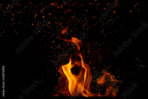 Fire flames and sparks on black background