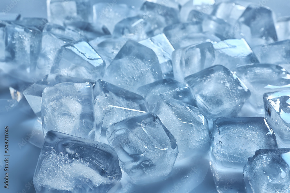Pile of ice cubes on color background, closeup Pile of ice cubes on color background, closeup