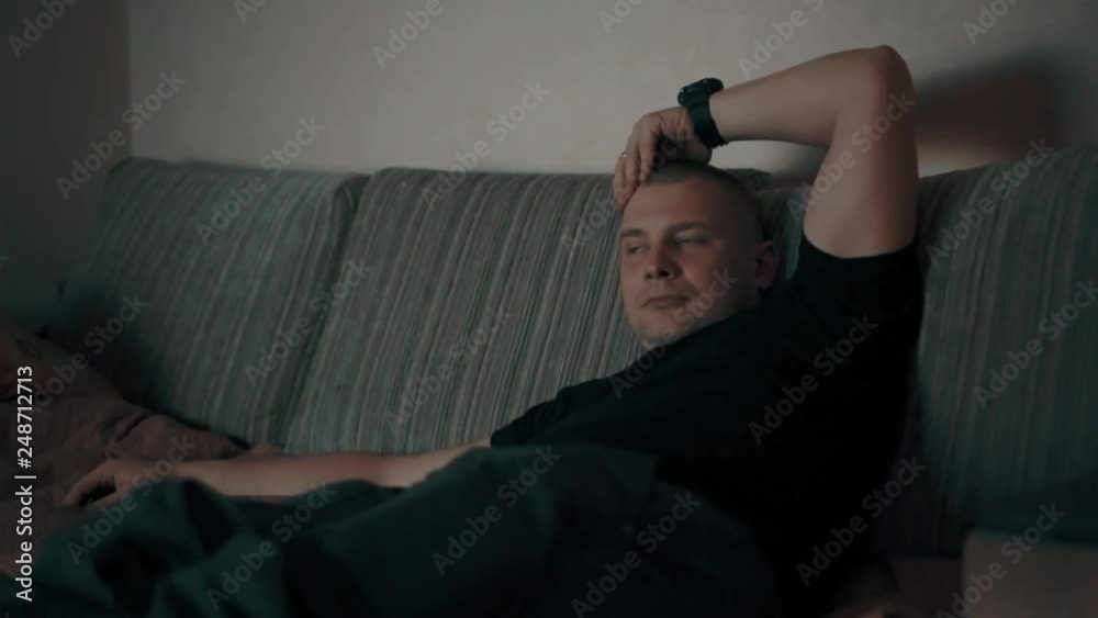 man watching tv on the couch man watching tv on the couch