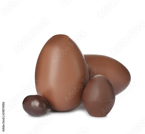 Tasty chocolate Easter eggs on white background