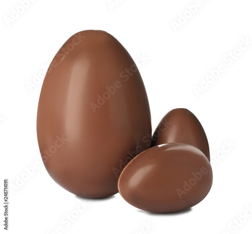 Tasty chocolate Easter eggs on white background