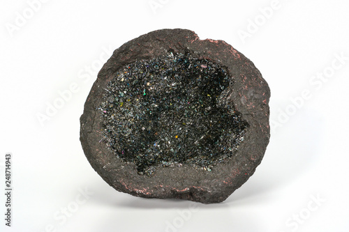 Volcanic bomb from the slopes of Vesuvius volcano, cut-in-half, filled with olivine and other minerals crystals. On white background, close up. photo