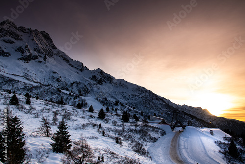 A beautiful sunset over the Tonale Pass and the mountains around it, during a winter sunny day. Tonale is a mountain pass between Lombardy and Trentino, near the Presena glacier