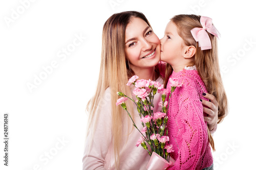 Portrait of happy smiling mother and daughter with bouquet of pink carnations isolated on white. Daughter kisses her mother. Happy family. Happy mother's day. Mothers day card.