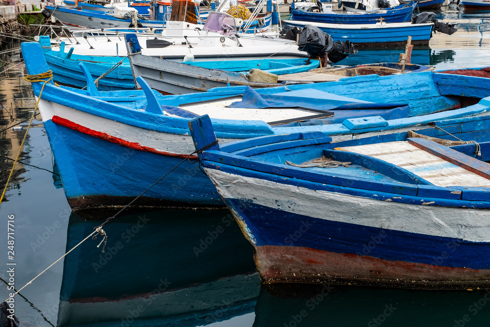 Traditional italian Wooden fishing boats on the old port in Palermo, Sicily