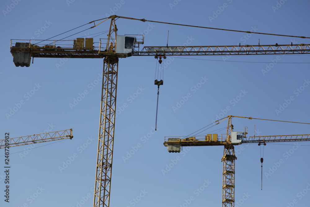 Large, big cranes. Nice, sunny day, blue sky.