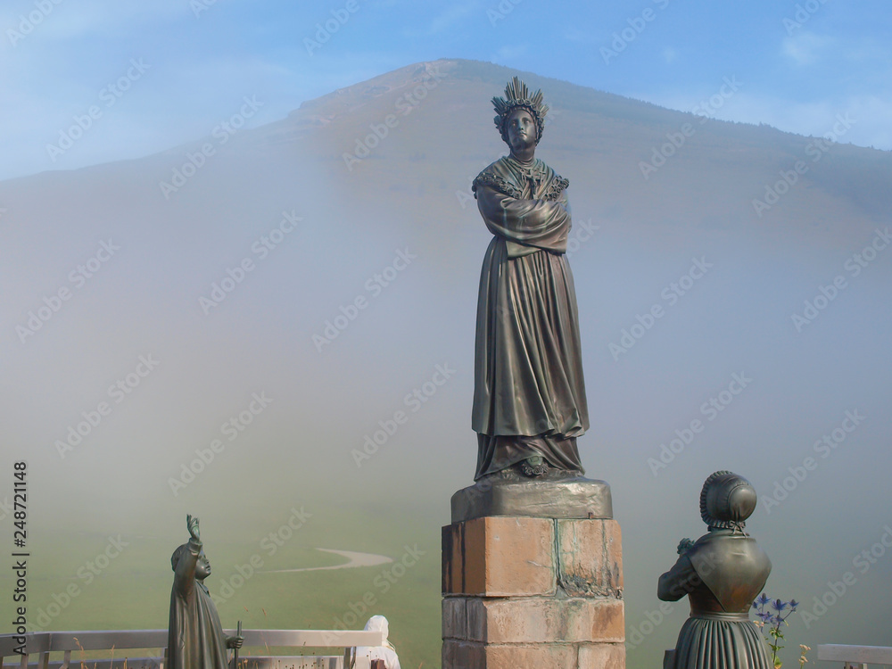 Statue depicting Our Lady of La Salette in a sanctuary in the Alps