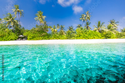 Summer travel destination. Design of summer vacation holiday concept. Perfect tranquil beach scene, soft sunlight and white sand and blue endless sea as tropical landscape