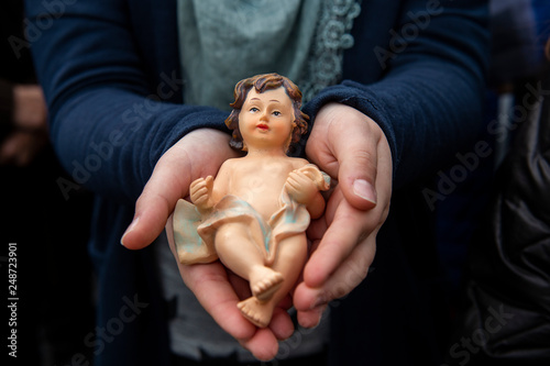 Vatican City, December 11, 2016: Children take Baby Jesus from their Nativity Scene (Tradition Bambinelli) to be blessed by Pope Francis during his Sunday Angelus prayer  in st. Peter's Square