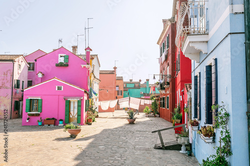 Colorful houses on the street in Burano island  near Venice. Tourism and vacation in Italy concept